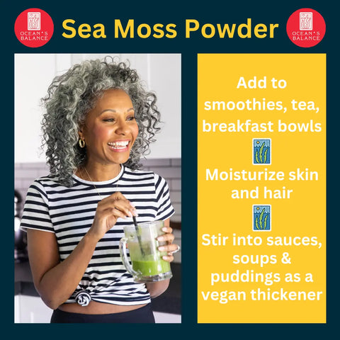 A smiling woman with curly gray hair and a striped shirt enjoys a green smoothie in her kitchen. Oceans Balance Sea Moss Powder: add to drinks/food, support thyroid health, moisturize skin/hair, or use as vegan thickener.