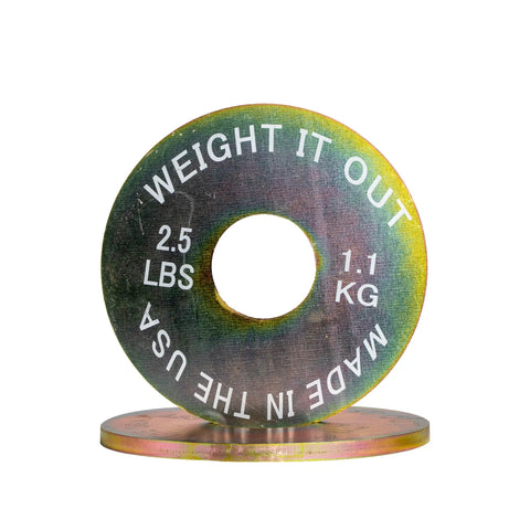 A Cast Iron 45lb Weight Plate from Weight It Out, marked with weight and MADE IN THE USA, stands upright beside another plate—ideal for building your calibrated solid steel weight plate sets.