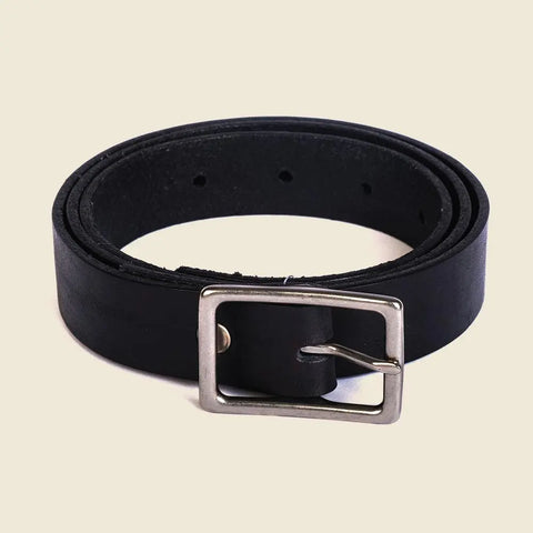 The Smith Thinner Belt Black by CASUPO is handcrafted from black vegetable tanned leather, features a silver rectangular buckle, and is displayed coiled on a light beige background.