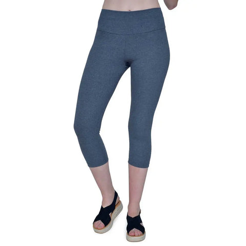 A person wearing Spiritex Yoga Capri 45/45/10 Charcoal by Spiritex | Sustainable Apparel and black open-toe platform sandals stands against a white background, with only the lower body visible.