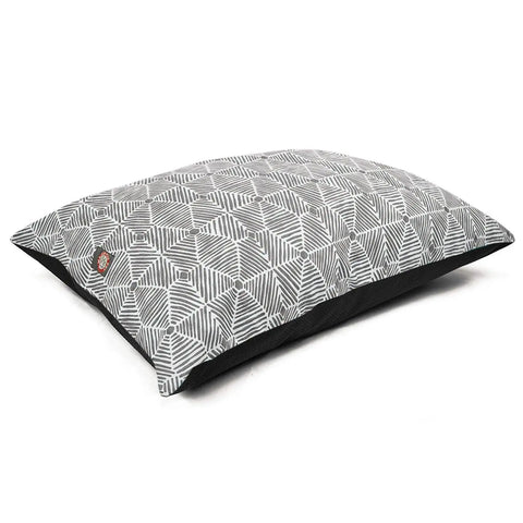 The Charlie Super Value Dog Bed by Majestic Pet features a stylish geometric black and white pattern with diagonal lines and diamond shapes. Comfortable for pets, it rests on a white background and is machine washable for easy care.