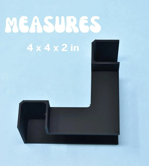 Chatelet Aquarium Underground Tunnel by Chatelet Manufacturing—an L-shaped black plastic organizer with three compartments for aquarium decor or fish hideouts, shown on light blue background with “MEASURES 4 x 4 x 2 in.” in white text above.