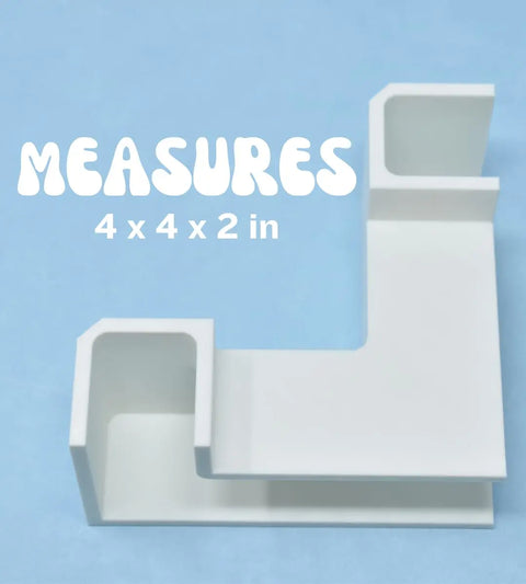 A white, L-shaped Chatelet Aquarium Underground Tunnel by Chatelet Manufacturing with two open compartments sits on a blue background. Text above reads: MEASURES 4 x 4 x 2 in. Ideal as a fish tank tunnel and aquarium decor. Made in USA.