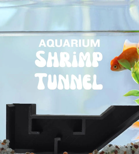 A goldfish swims above the Chatelet Aquarium Underground Tunnel by Chatelet Manufacturing, a black fish and shrimp hideout decorated with green plants and gravel. Bold white text reads: Aquarium Shrimp Tunnel. Made in USA.
