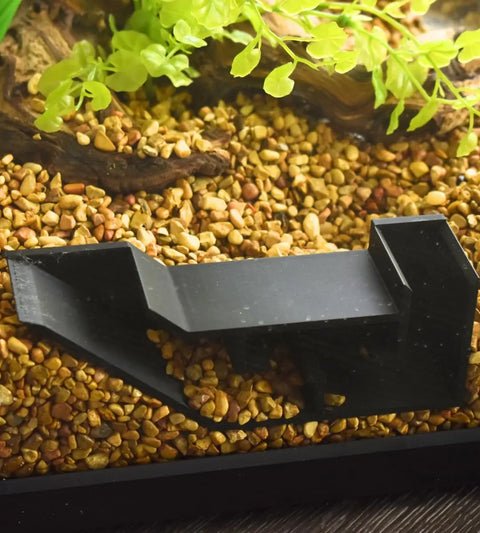 The Chatelet Aquarium Underground Tunnel by Chatelet Manufacturing is a black fish and shrimp hideout that creates a unique viewing tunnel beneath aquarium gravel for standout decor. Made in the USA.