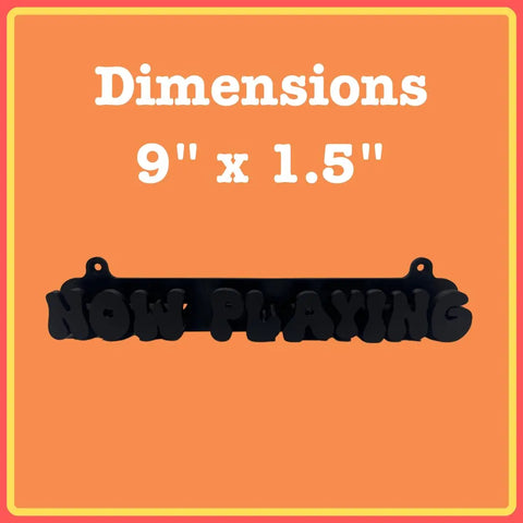 The Chatelet Groovy Now Playing Vinyl Record Wall Mount by Chatelet Manufacturing is a retro black NOW PLAYING sign, ideal for vinyl displays. Shown on an orange background with red/yellow border; white text above reads: Dimensions 9 x 1.5. Made in USA.