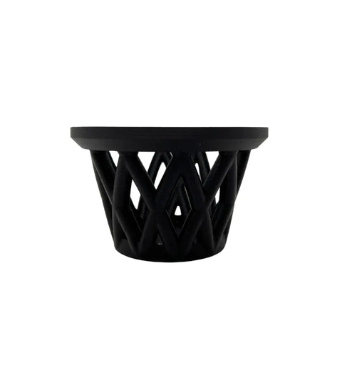 The Chatelet Aquarium Fish Feeding Cage by Chatelet Manufacturing is a modern black cylinder with an open lattice design and flat rim, designed to float at the surface and keep larger fish out. Made in the USA.