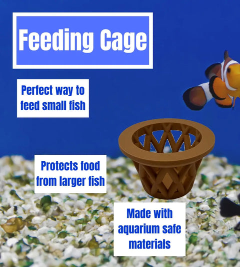 A Chatelet Aquarium Fish Feeding Cage by Chatelet Manufacturing floats on gravel near a clownfish, providing the perfect way to feed small fish, protecting food from larger fish, and made with aquarium-safe materials in the USA.