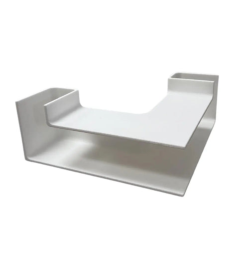 The Chatelet Aquarium Underground XL Corner Tunnel by Chatelet Manufacturing is a white, L-shaped fish and shrimp hideout with an elevated platform and middle cutout—perfect for unique aquarium decor—shown on a plain white background.