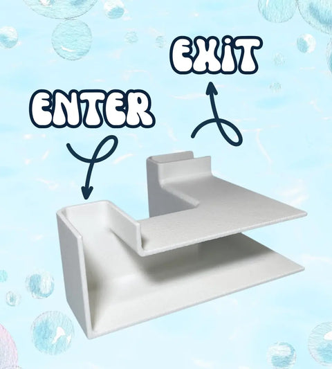 The Chatelet Aquarium Underground XL Corner Tunnel by Chatelet Manufacturing is a white, L-shaped fish and shrimp hideout featuring labeled Enter and Exit arrows—an eye-catching, unique aquarium tunnel made in the USA.