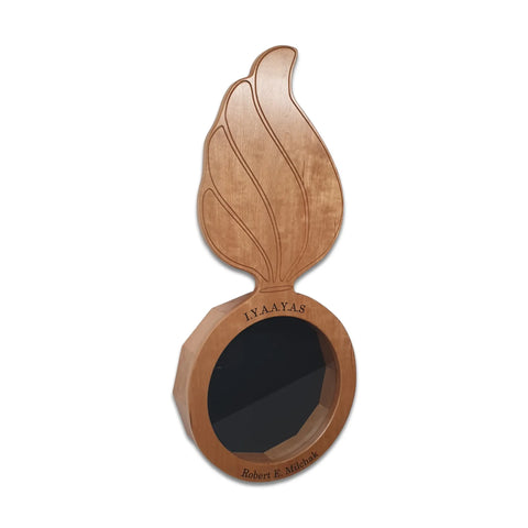 The Cherry Ammo Pisspot Shadow Box by Legacies of America Woodworking Company is a cherry hardwood plaque, USA-made, featuring a large flame above a hexagonal frame with I.Y.A.A.Y.A.S. and Robert E. Michaik engraved, shown on a white background.