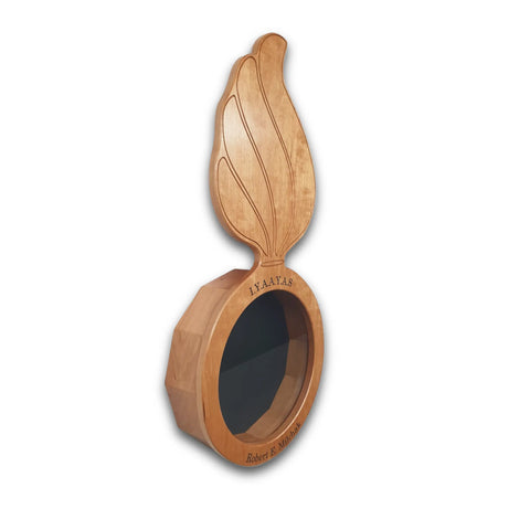 The Cherry Ammo Pisspot Shadow Box by Legacies of America Woodworking Company is a wooden display with a round cherry hardwood base, an upright sculpted wing, and engraving: IAA LTAS and Robert E. Mitchell. Made in USA. Open center for display.