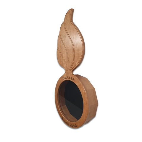 The Cherry Ammo Pisspot Shadow Box by Legacies of America Woodworking Company features an oval Cherry Hardwood base with a circular black opening, engraved IYAAYAS and Master R. Minick, plus a large leaf accent. Made in the USA.