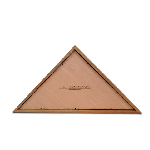 The Cherry Burial Flag Display Case (5 x 9.5) by Legacies of America Woodworking Company is a handcrafted triangular wooden case with a smooth surface and thin border, featuring small printed details, photographed against a white background.