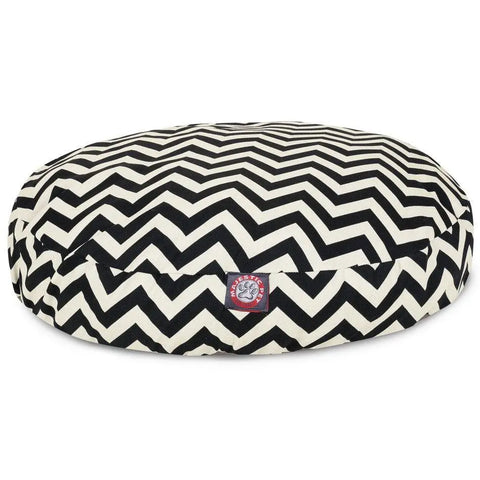 The Majestic Pet Chevron Round Dog Bed has a black and white zigzag pattern, a front logo tag, soft cushioned support for comfort, and a removable washable cover for easy cleaning.