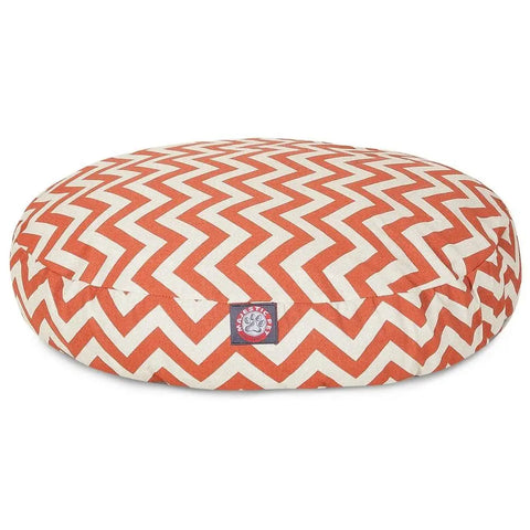 The Majestic Pet Chevron Round Dog Bed features an orange and white chevron pattern, a small paw print label, and a removable, washable cover for easy cleaning and stylish comfort.