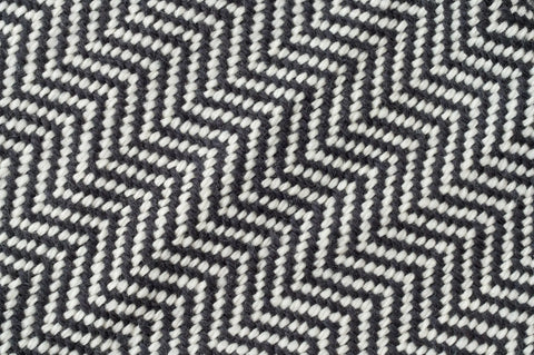 Close-up of the Chevron Pattern Soft Wool Throw Size Blanket by American Blossom Linens, featuring a black and white chevron design in Climate Beneficial wool that highlights its soft texture and geometric pattern.