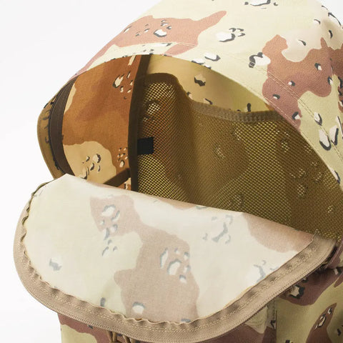 A close-up of the MIS Daypack - Chocochip Desert Camo, featuring packcloth nylon with a desert camo pattern, light brown mesh interior, and flap lid—ideal for a 13 laptop—shown against a plain white background.