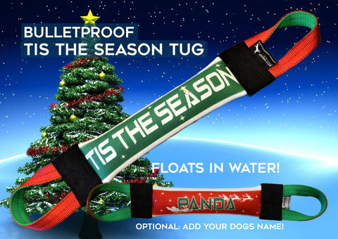 Two festive dog toys—Tis the Season and Panda—float before a Christmas tree. This USA-made Bulletproof Pet Products tug is customizable, floats, and ideal for holiday fire hose training fun with your pup!.