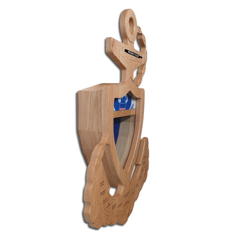 The Coast Guard Chief Petty Officer (CPO) Anchor Shadow Box by Legacies of America Woodworking Company is a wooden anchor-shaped display with a shield center, engraved details, and small compartment, crafted by veterans.