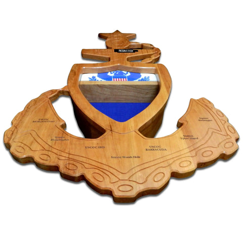 The Coast Guard Senior Chief Petty Officer (SCPO) Anchor Shadow Box by Legacies of America Woodworking Company is crafted from quality hardwoods, featuring a glass display compartment and engraved ship names—proudly made in the USA.