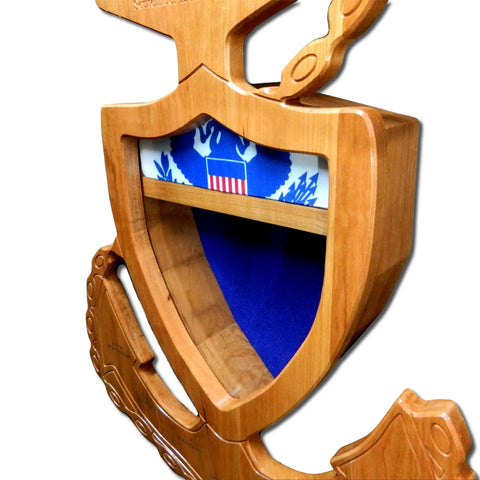 The Coast Guard Senior Chief Petty Officer (SCPO) Anchor Shadow Box by Legacies of America Woodworking Company features real hardwood construction, a blue and white background, intricate carving, a central shelf, and a shield motif.