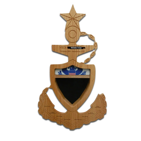 The Coast Guard Senior Chief Petty Officer (SCPO) Anchor Shadow Box by Legacies of America Woodworking Company is crafted from fine hardwood, featuring a star, gold chain detail, blue-and-white shield emblem, and black nameplate on a white background.