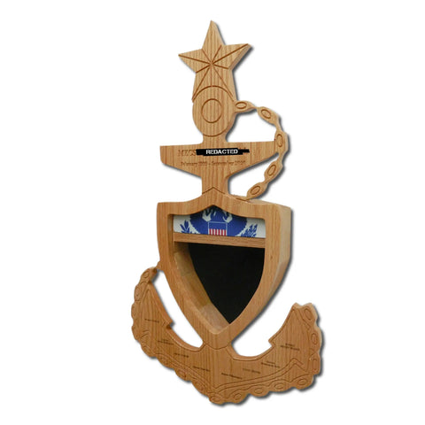 The Coast Guard Senior Chief Petty Officer (SCPO) Anchor Shadow Box by Legacies of America Woodworking Company is expertly crafted and features anchor details, a gold star, chain, shield with eagle, and a blank space. Made by veterans; some text is redacted.