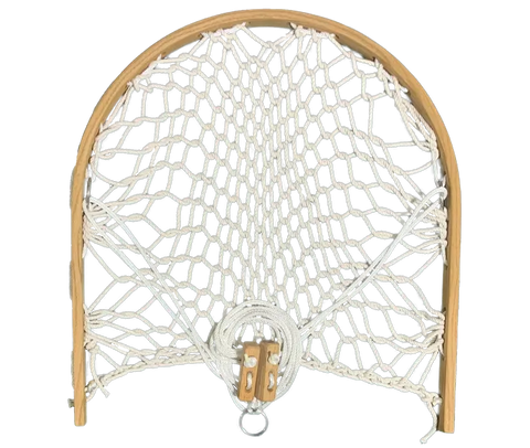 The Cobble Mountain Original Foothold is a small, wooden-framed net with white rope, pulley, and metal ring—an ideal accessory or foothold for your Cobble Mountain hammock chair.