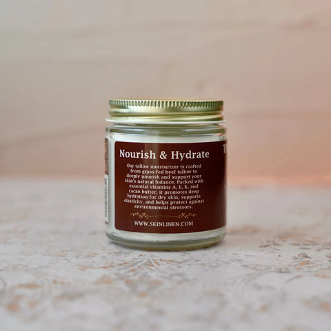 Jar labeled 'Nourish & Hydrate' on a textured surface with a blurred background