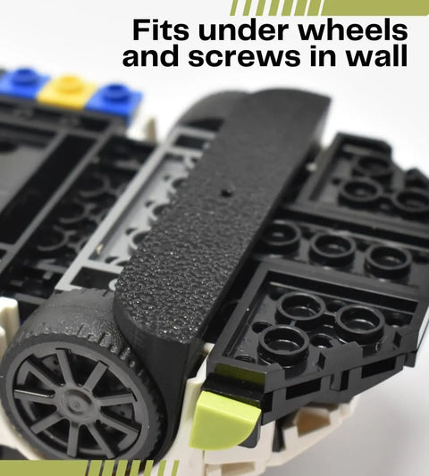 Close-up of Chatelet Manufacturing’s Collectible Car Display Wall Mount—low-profile, USA-made, fits under wheels and screws into wall. Ideal for displaying Lego car models, with stylish green decorative corner lines.