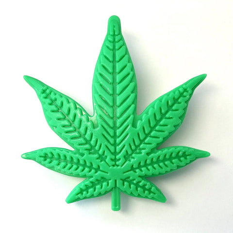The SodaPup Colorado Maple Leaf EChew is a green nylon dog chew toy shaped like a cannabis leaf, shown on a white background.