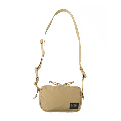 The MIS AW Shoulder Bag S in Coyote Tan is a small rectangular nylon shoulder bag with an adjustable strap, water-resistant zipper, and a MIS logo patch on the lower front. Shown on a plain white background.