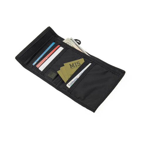 The MIS Folding Wallet - Black, made in the USA, is open to reveal neatly organized cards and cash. A California ID card and other cards are partially visible in its compartments.