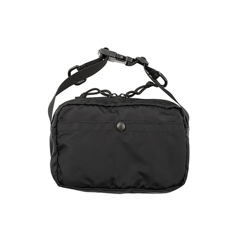 The MIS AW Shoulder Bag S - Black is a compact, water-resistant Packcloth Nylon bag with a front snap button pocket and adjustable shoulder strap, shown against a white background.