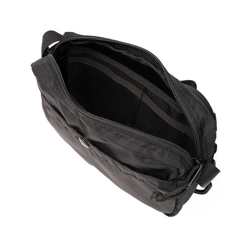 The MIS AW Shoulder Bag S - Black is made from water-resistant Packcloth Nylon, shown from above with its main compartment open, revealing inner pockets and a spacious interior. Comes with an adjustable shoulder strap for versatile carrying.