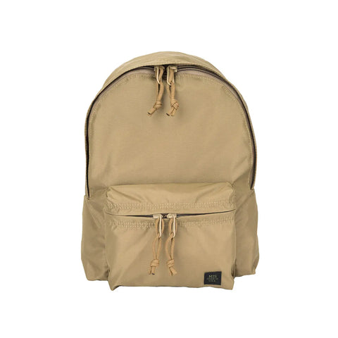 The MIS Daypack S in Coyote Tan is a water-resistant packcloth nylon backpack with a large main compartment, front zippered pocket, side pockets, tan zipper pulls, and a small black label near the bottom right of the front pocket.