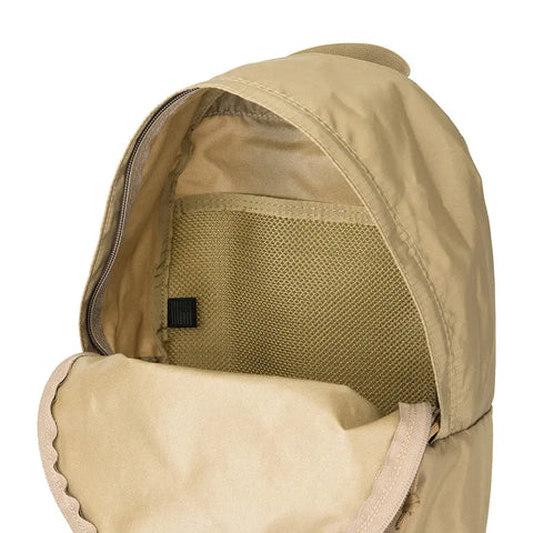 A close-up of the MIS Daypack S in Coyote Tan, featuring its open packcloth nylon interior with a mesh pocket and zipper, and the hooded top flap pulled back.