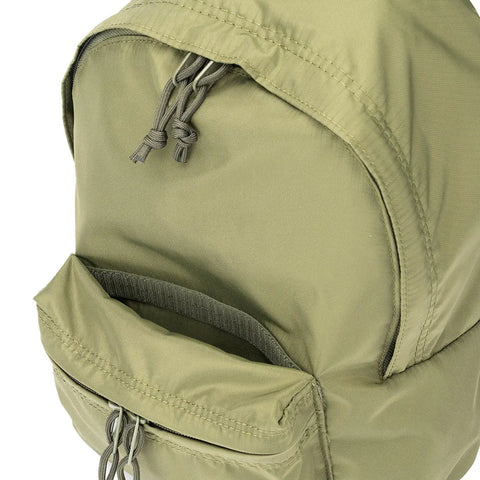 Close-up of the top section of the MIS Daypack S - Olive, featuring partially open main and front compartments with two knotted zipper pulls on durable packcloth nylon.