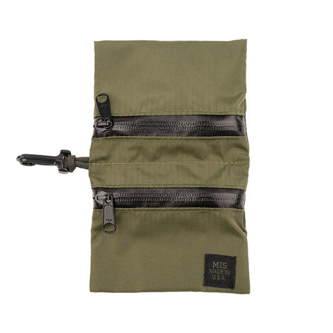 The MIS W Small Pouch - Olive is a water-resistant nylon pouch featuring two horizontal black zippered pockets, a side clip for attachment, and a small black MIS Made in USA patch at the bottom right.