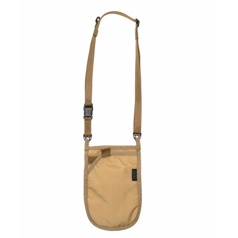 The MIS Shoulder Pouch Gen2 - Coyote is a compact, tan crossbody bag with an adjustable strap, curved bottom, front pocket for secure storage, minimalist design, and a black front label.