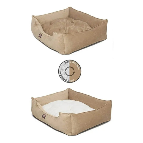 The Majestic Pet Villa Contemporary Lounge Bed is shown in tan, featuring reversible cushions in light brown and white. An icon highlights the dual-color mat, offering both style and practicality for your pet.