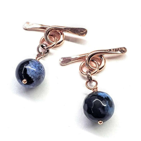 Copper Child Abuse Prevention Awareness Chain Cufflinks by Alexa Martha Designs feature hammered metal bars, circular links, and faceted black blue agate beads hanging below.