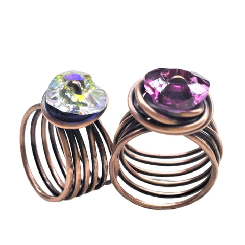 The Copper Wire Wrapped Crystal Heart Glam Ring by Alexa Martha from Alexa Martha Designs features a faceted gemstone in a modern, artistic copper wire wrap—perfect for anyone who loves unique handmade crystal rings.