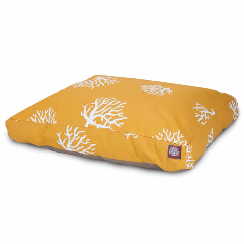 The Majestic Pet Coral Rectangle Dog Bed is a rectangular yellow cushion with white coral-like patterns and a sewn tag, shown on a plain white background—stylish, comfortable, and washable for your pet.