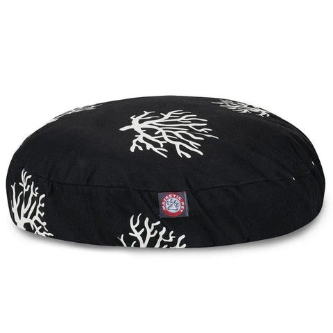 The Majestic Pet Coral Round Dog Bed features black fabric with white coral patterns, a small red and white logo tag, and a removable, washable cover for style and convenience.