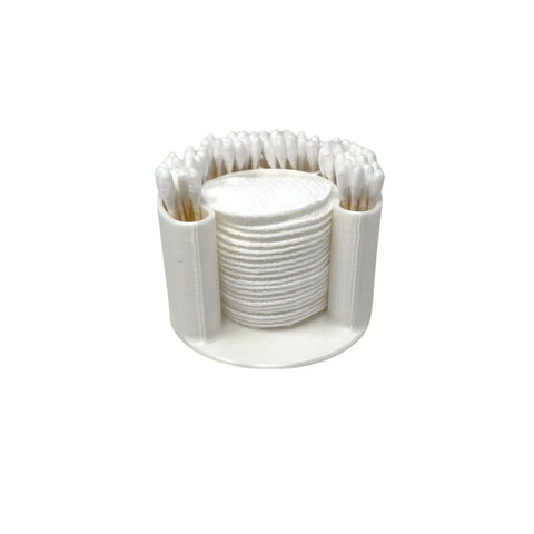 The Chatelet Manufacturing Cotton Swab Bathroom Organizer in clean white conveniently stores q-tips vertically around the edge and cotton or exfoliating pads in the center, keeping your bathroom essentials organized.