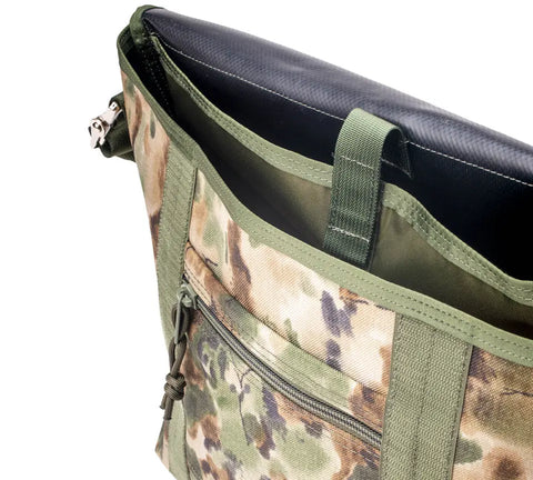 A close-up of the MIS Messenger Bag - Covert Woodland shows its green trim, zippered front pocket, and black interior. This durable, camouflage-patterned Cordura Nylon laptop bag is waterproof and made in the USA.