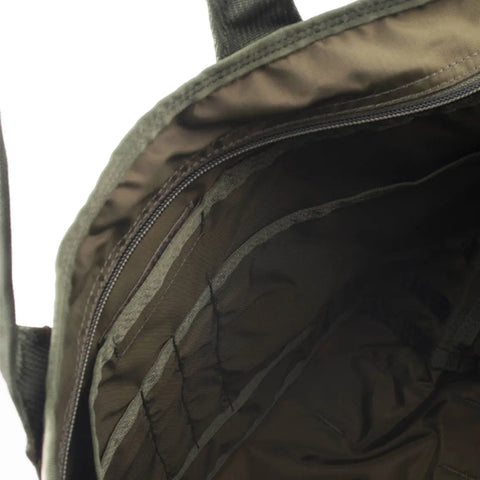 Close-up of the empty MIS Tote Bag - Covert Woodland in olive green Cordura Nylon, showing multiple fabric compartments and a heavy-duty zipper for secure, water-resistant organization.