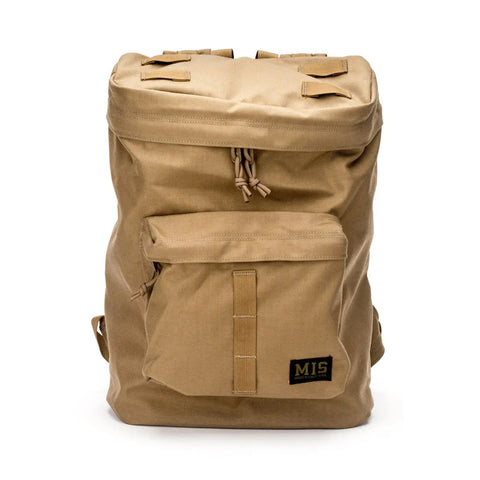 The MIS Backpack - Coyote Brown features tan Cordura Nylon, a spacious main compartment, padded laptop holder, front zip pocket, two top straps, water-resistant design, and a black and gold MIS logo patch on the front pocket.